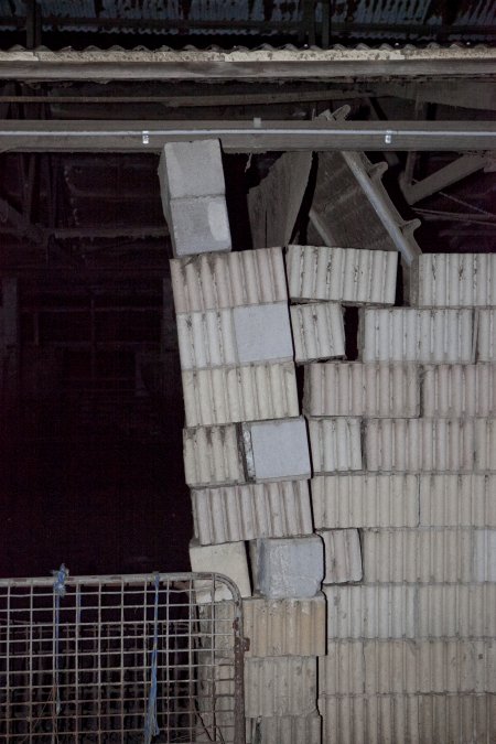 Crumbling wall of piggery shed structure