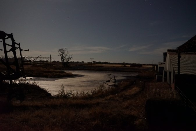 Manure lagoon outside at night