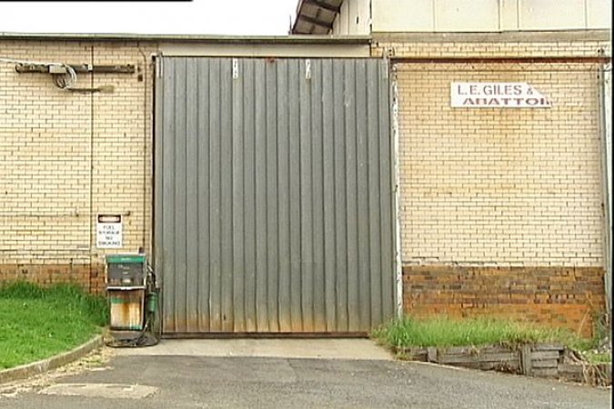 Large sliding door and sign showing 'LE Giles & Sons Abattoir'