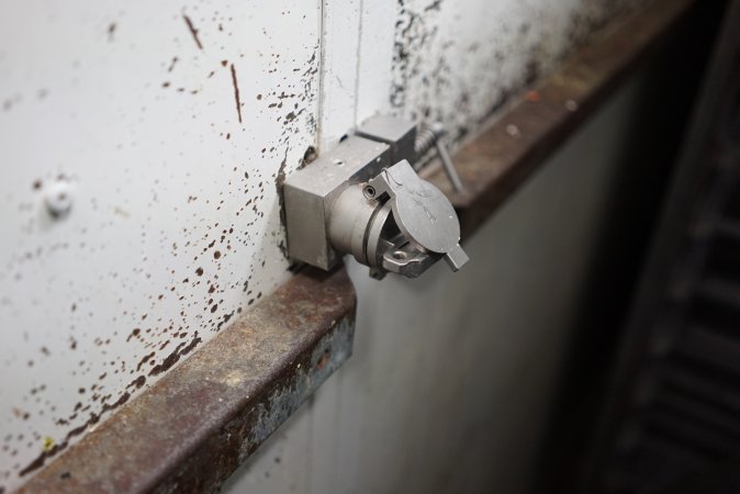 Lock on door of sealed maceration room