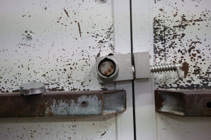 Lock on door of sealed maceration room