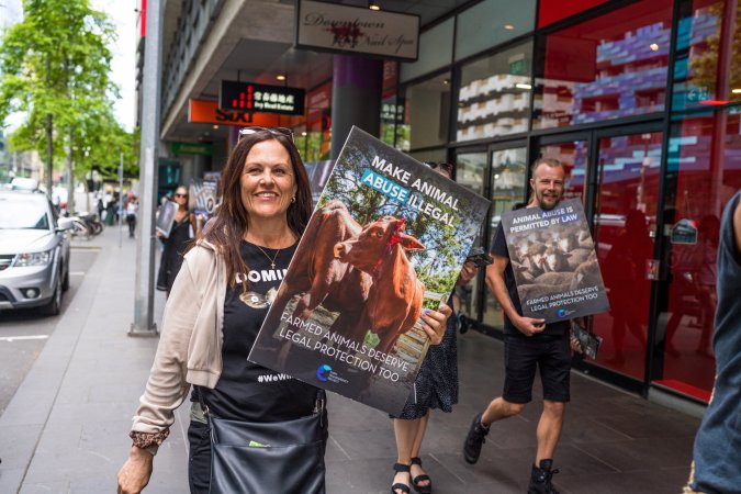 Activists protest the widespread use of cages for pigs