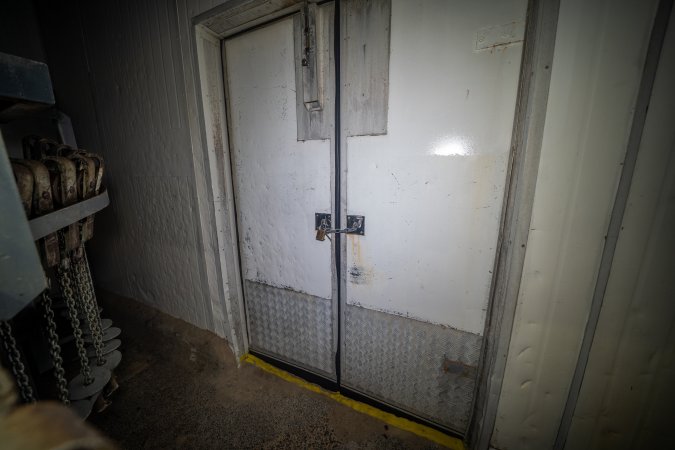 Kill room door with padlock