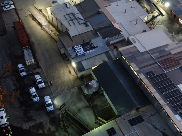 Aerial view of activists on roof of slaughterhouse