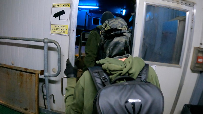 Investigators enter the gas chamber room at Corowa Slaughterhouse