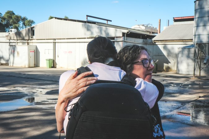 Activists bearing witness to pigs being unloaded at Benalla pig slaughterhouse in Victoria