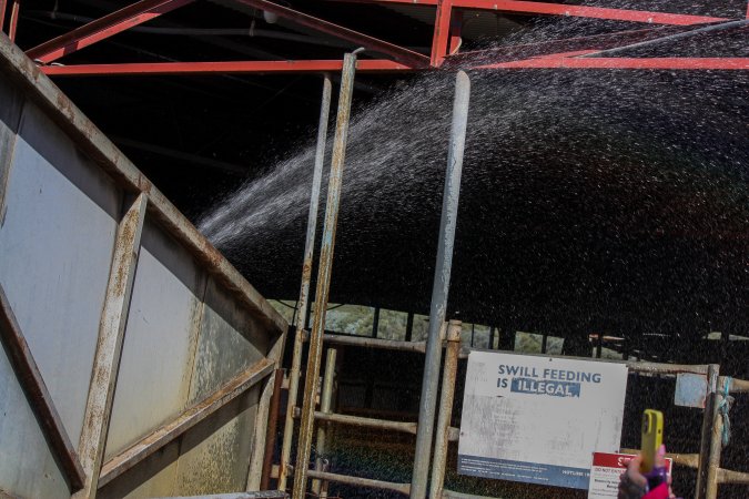 Benalla Worker Spraying Activists with Water