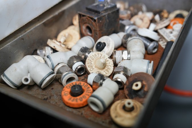 Tray containing ear tags next to knock box