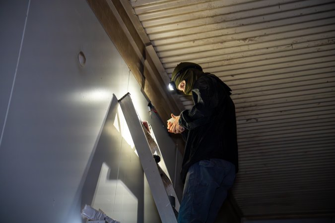 Investigator looks for places to install hidden cameras