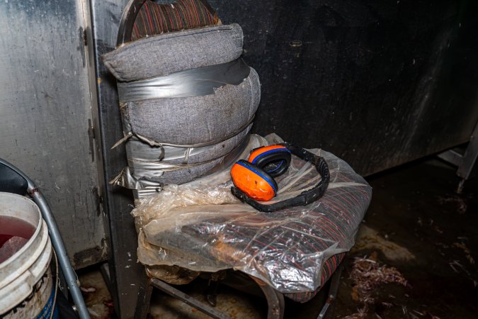 Chair with earmuffs near shackle line