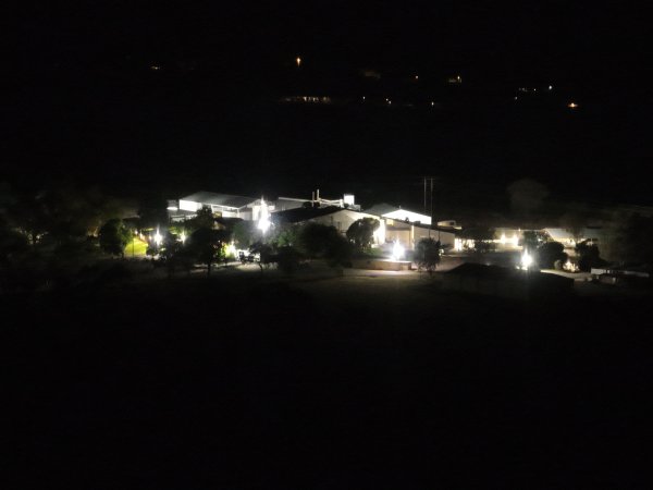 Drone flyover of slaughterhouse at night