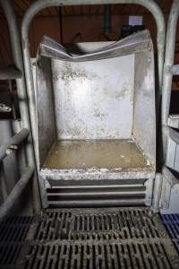 Feed tray in empty farrowing crate - Australian pig farming - Captured at Golden Grove Piggery, Young NSW Australia.