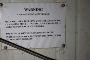 Sign: 'Commonsense must prevail' - Feed trolley advice for staff - Captured at Finniss Park Piggery, Mannum SA Australia.