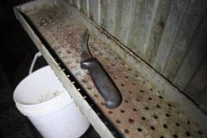 Knife near cattle knockbox - Gathercoles slaughterhouse, Wangaratta - killing and processing areas. - Captured at Gathercole's Wangaratta Abattoir, Wangaratta VIC Australia.