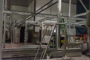 New killing/processing building containing giant gas chamber - Under construction at time of photos (2015). Gondolas much larger to gas many more pigs at once. Side of chamber opens, wall closes in to push pigs into gondola. - Captured at Diamond Valley Pork, Laverton North VIC Australia.