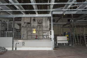 New killing/processing building containing giant gas chamber - Under construction at time of photos (2015). Gondolas much larger to gas many more pigs at once. Side of chamber opens, wall closes in to push pigs into gondola. - Captured at Diamond Valley Pork, Laverton North VIC Australia.