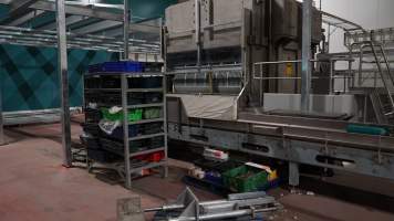 New killing/processing building containing giant gas chamber - Under construction at time of photos (2015). Gondolas much larger to gas many more pigs at once. Side of chamber opens, wall closes in to push pigs into gondola. - Captured at Diamond Valley Pork, Laverton North VIC Australia.