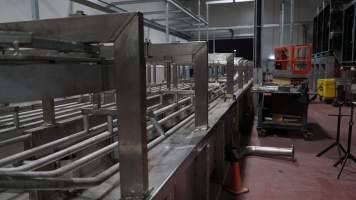 New killing/processing building containing large long scalding tank - Under construction at time of photos (2015). Gondolas much larger to gas many more pigs at once. Side of chamber opens, wall closes in to push pigs into gondola. - Captured at Diamond Valley Pork, Laverton North VIC Australia.