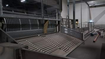 New killing/processing building containing giant gas chamber - Under construction at time of photos (2015). Gondolas much larger to gas many more pigs at once. Side of chamber opens, wall closes in to push pigs into gondola. - Captured at Diamond Valley Pork, Laverton North VIC Australia.