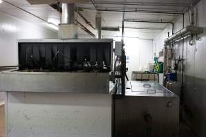 Tray cleaning machine - Cleans empty trays after chicks dumped out - Captured at SBA Hatchery, Bagshot VIC Australia.