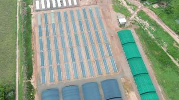 Crocodile cages and solitary stall sheds - Drone flyover of Janamba Crocodile Farm, Middle Point NT. - Captured at Janamba Crocodile Farm (Middle Point), Middle Point NT Australia.