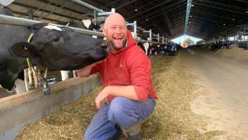Farmer poses in intensive dairy shed - The Clymo's (