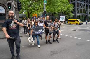 Activists protest the widespread use of cages for pigs - Image taken at Spencer Street as part of the Melbourne Vegan Takeover - Day of Action for Animals - Captured at VIC.