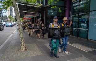 Activists protest the widespread use of cages for pigs - Image taken at Spencer Street as part of the Melbourne Vegan Takeover - Day of Action for Animals - Captured at VIC.