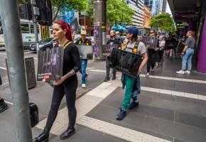 Activists protest the widespread use of cages for pigs - Image taken at Spencer Street as part of the Melbourne Vegan Takeover - Day of Action for Animals - Captured at VIC.