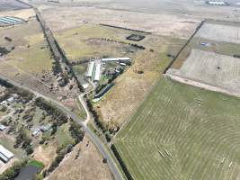 Drone flyover of free-range egg farm - Layer hens seen outside - Captured at Free-range egg farm (Peter & Cheryl King), Lethbridge VIC Australia.