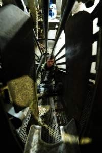 Activist prepares to seal inside a gondola in the gas chamber - Activists shut down Benalla Slaughterhouse - Captured at Benalla Abattoir, Benalla VIC Australia.