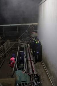 Police speak with activists chained inside race - Activists shut down Benalla slaughterhouse.
Photo by Catriona Marshall. - Captured at Benalla Abattoir, Benalla VIC Australia.