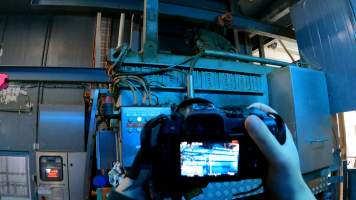 Investigator filming inside the gas chamber room at Corowa Slaughterhouse - Captured at Corowa Slaughterhouse, Redlands NSW Australia.