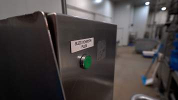 Button to operate the conveyor where pigs bleed out after being stuck - In August and September 2023, investigators from Farm Transparency Project installed covert cameras to document the slaughter of pigs at the facility, including the use of electrical stunning, which is considered to be an alternative to the carbon dioxide gas chambers used in the majority of pig slaughterhouses Australia wide. Pigs were filmed showing signs of consciousness after having been stunned, including while bleeding out and while being lowered into the scalding tank. - Captured at Scottsdale Pork, Springfield TAS Australia.