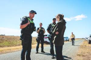 Animal activists asking for the release of Olivia (sow 8416) at Midland Bacon in Victoria - Image taken outside Midland Bacon, where a worker was filmed r*ping sow 8416 (now named Olivia) while she was trapped inside her farrowing crate. This day of action was part of the campaign to Free Olivia. - Captured at Midland Bacon, Carag Carag VIC Australia.