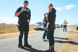 Animal activists asking for the release of Olivia (sow 8416) at Midland Bacon in Victoria - Image taken outside Midland Bacon, where a worker was filmed r*ping sow 8416 (now named Olivia) while she was trapped inside her farrowing crate. This day of action was part of the campaign to Free Olivia. - Captured at Midland Bacon, Carag Carag VIC Australia.