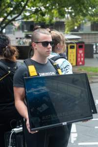 Animal rights activists at Dominion Outreach Melbourne - Animal rights activists attending a street outreach event in Southbank, Melbourne, Australia to bring awareness to the reality of modern animal farming and slaughter practices using footage from Dominion. - Captured at VIC.