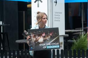 Animal rights activists at Dominion Outreach Melbourne - Animal rights activists attending a street outreach event in Southbank, Melbourne, Australia to bring awareness to the reality of modern animal farming and slaughter practices using footage from Dominion. - Captured at VIC.