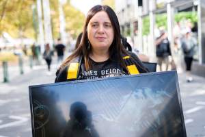 Animal rights activists at Dominion Outreach Melbourne - Animal rights activists attending a street outreach event in Southbank, Melbourne, Australia to bring awareness to the reality of dairy farming and slaughter practices using footage from Farm Transparency Project investigations. - Captured at VIC.