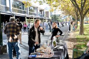 Animal rights activists at Dominion Outreach Melbourne - Animal rights activists attending a street outreach event in Southbank, Melbourne, Australia to bring awareness to the reality of dairy farming and slaughter practices using footage from Farm Transparency Project investigations. - Captured at VIC.