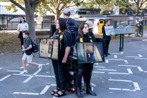 Animal rights activists at Dominion Outreach Melbourne - Animal rights activists attending a street outreach event in Southbank, Melbourne, Australia to bring awareness to the reality of dairy farming and slaughter practices using footage from Farm Transparency Project investigations. - Captured at VIC.