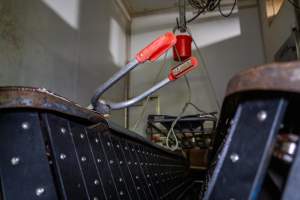Electric stunning tongs on V restraint - Captured at Carey Bros Abattoir, Yangan QLD Australia.
