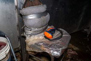 Chair with earmuffs near shackle line - Captured at Tinder Creek Duck Abattoir, Tennyson NSW Australia.