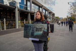 22 June 2025: 5 Question Challenge: Dominion Outreach Melbourne - Animal rights activists participating in a street outreach event in Southbank, Victoria, Australia. Some volunteers hold placards inviting pedestrians to answer 5 questions in exchange for a vegan treat. Others hold TVs showing footage from Farm Transparency Project’s dairy investigations. Together, they bring awareness to the hidden reality of what happens to cows, calves, and bulls in the Australian dairy industry. - Captured at VIC.