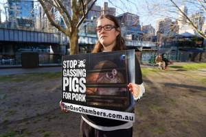 3 August 2025: Dominion Outreach Melbourne: Shut Down Slaughterhouses - Animal rights activists participating in a street outreach event in Southbank, Naarm/Melbourne. Some wear TVs showing footage from Farm Transparency Project's slaughterhouse investigations as part of the Shut Down Slaughterhouses campaign. Others hold placards or engage the public in conversations. Together, they bring awareness to the hidden reality of what happens to animals inside slaughterhouses. - Captured at VIC.