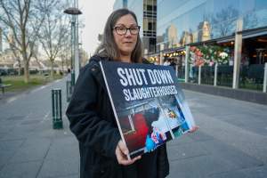 3 August 2025: Dominion Outreach Melbourne: Shut Down Slaughterhouses - Animal rights activists participating in a street outreach event in Southbank, Naarm/Melbourne. Some wear TVs showing footage from Farm Transparency Project's slaughterhouse investigations as part of the Shut Down Slaughterhouses campaign. Others hold placards or engage the public in conversations. Together, they bring awareness to the hidden reality of what happens to animals inside slaughterhouses. - Captured at VIC.
