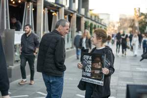 3 August 2025: Dominion Outreach Melbourne: Shut Down Slaughterhouses - Animal rights activists participating in a street outreach event in Southbank, Naarm/Melbourne. Some wear TVs showing footage from Farm Transparency Project's slaughterhouse investigations as part of the Shut Down Slaughterhouses campaign. Others hold placards or engage the public in conversations. Together, they bring awareness to the hidden reality of what happens to animals inside slaughterhouses. - Captured at VIC.