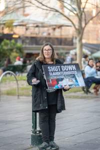 3 August 2025: Dominion Outreach Melbourne: Shut Down Slaughterhouses - Animal rights activists participating in a street outreach event in Southbank, Naarm/Melbourne. Some wear TVs showing footage from Farm Transparency Project's slaughterhouse investigations as part of the Shut Down Slaughterhouses campaign. Others hold placards or engage the public in conversations. Together, they bring awareness to the hidden reality of what happens to animals inside slaughterhouses. - Captured at VIC.
