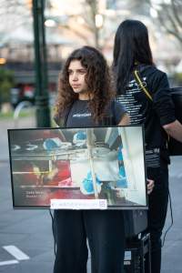 3 August 2025: Dominion Outreach Melbourne: Shut Down Slaughterhouses - Animal rights activists participating in a street outreach event in Southbank, Naarm/Melbourne. Some wear TVs showing footage from Farm Transparency Project's slaughterhouse investigations as part of the Shut Down Slaughterhouses campaign. Others hold placards or engage the public in conversations. Together, they bring awareness to the hidden reality of what happens to animals inside slaughterhouses. - Captured at VIC.