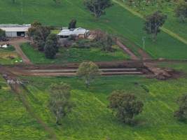 Drone flyover - Drone flyover of unknown dairy showing calf sheds and milking shed. - Captured at Unknown Dairy - Devondale, Woods Point SA Australia.